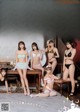 A group of young women in lingerie posing for a magazine cover.