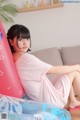 A woman sitting on top of an inflatable pool float.
